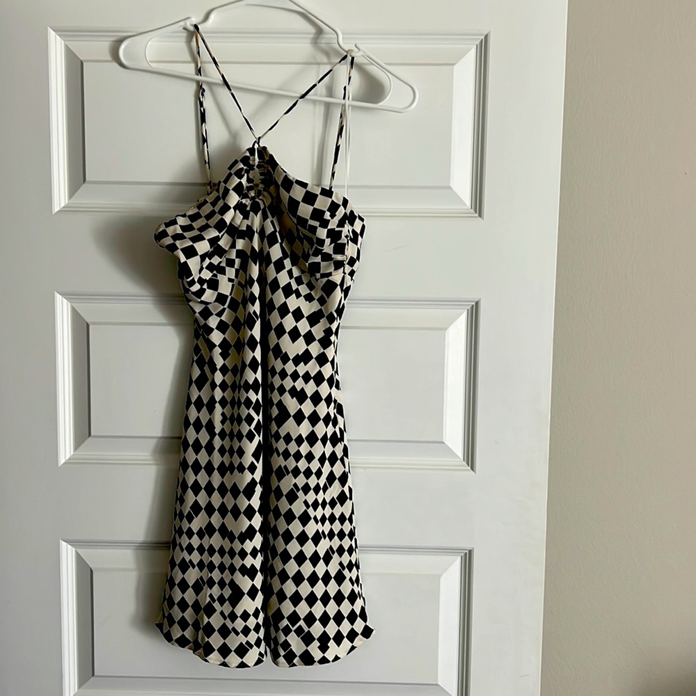 Checkered white and black dress with halter key hole type top.